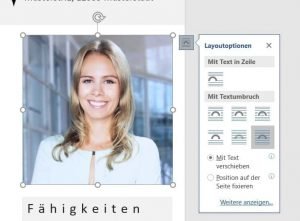 Move the photo in front of the text in Word. In the next step you can cut out the photo round.